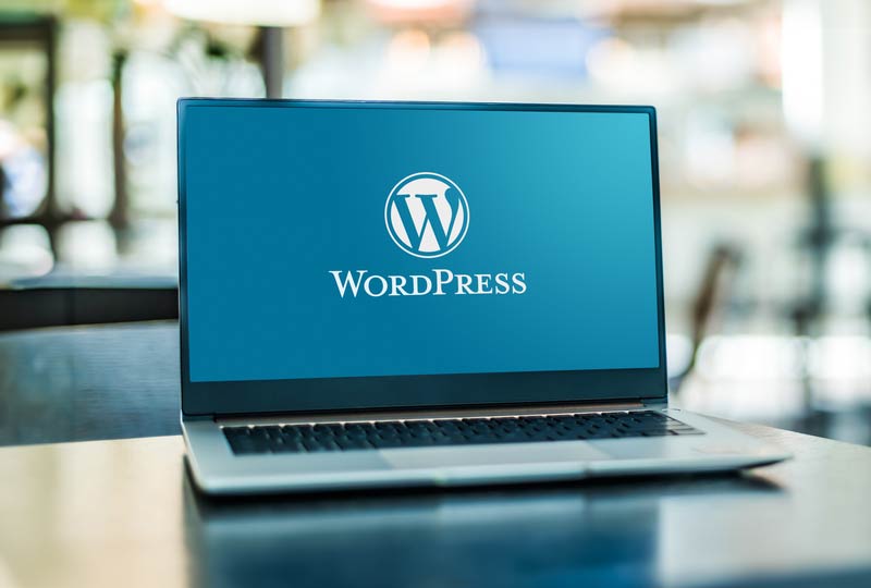 A laptop with WordPress on the screen